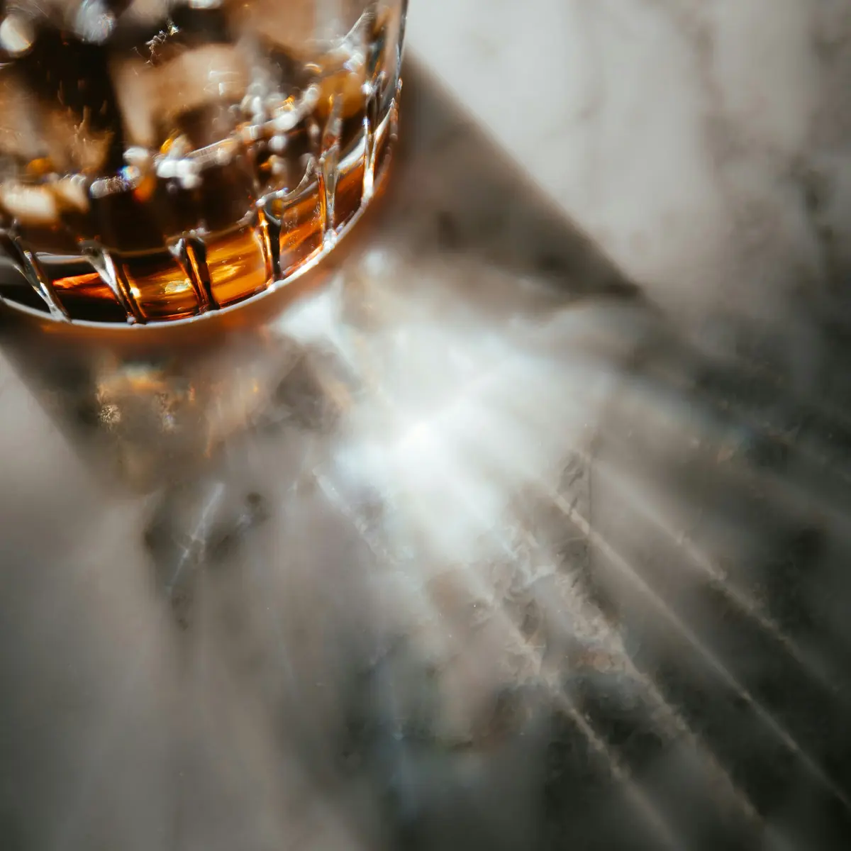 A tumbler of whisky on marble