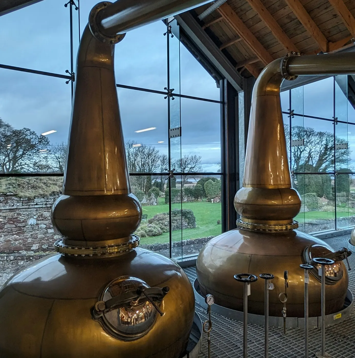 Copper pot stills in a distillery still house